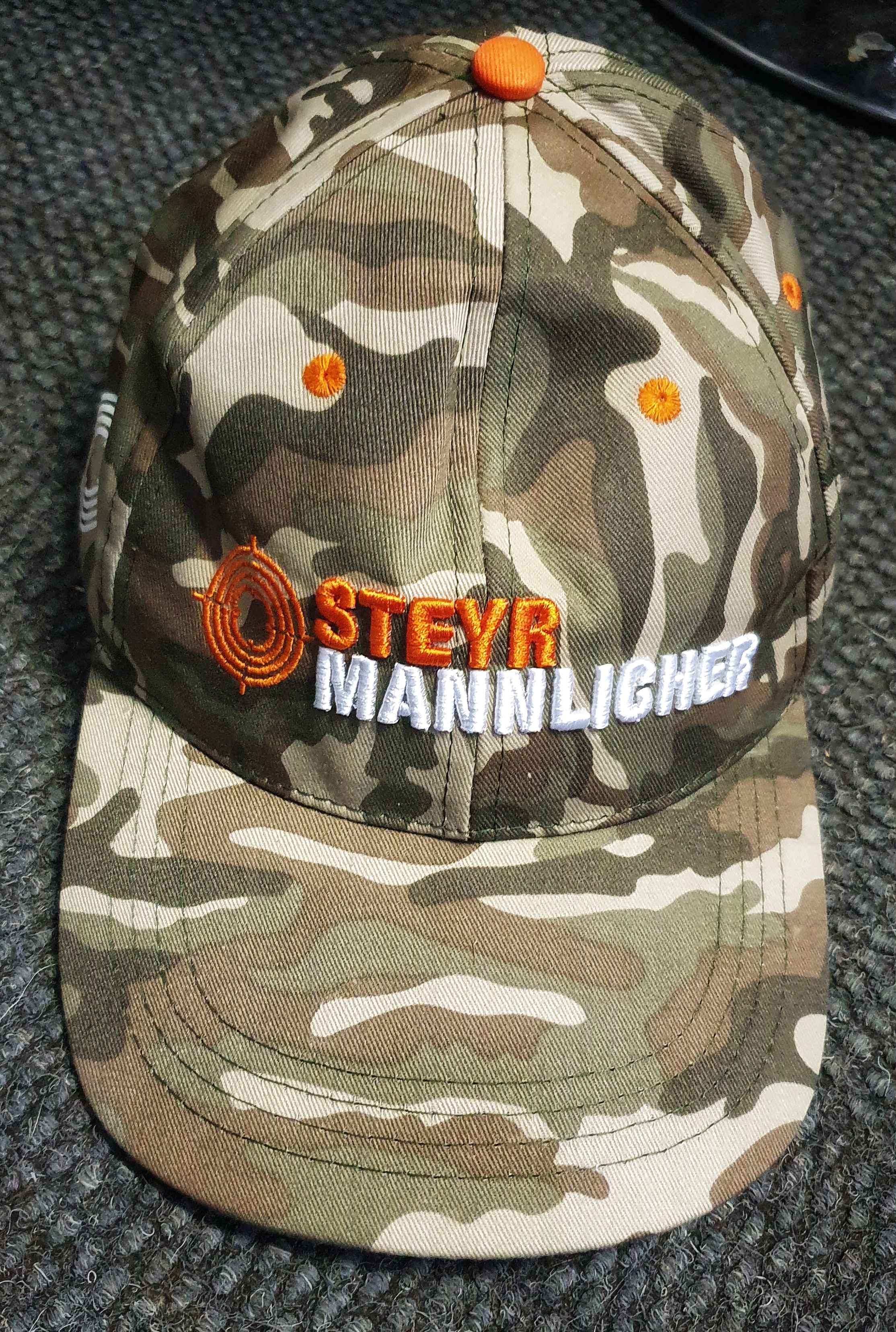 steyer-and-manligher-camo-orange-and-white-cap